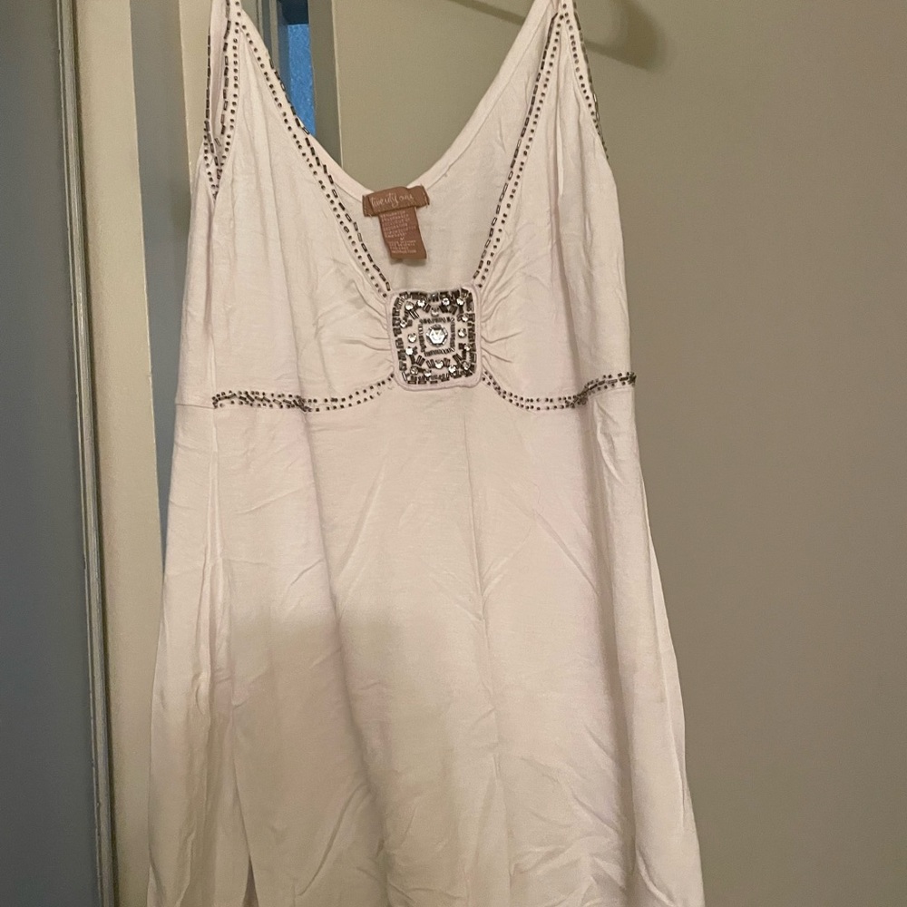 Adorable dressy tank top with silver beading.